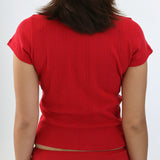Person wearing a red outfit on a white background