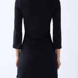 Black dress with 3/4 sleeves on a white background