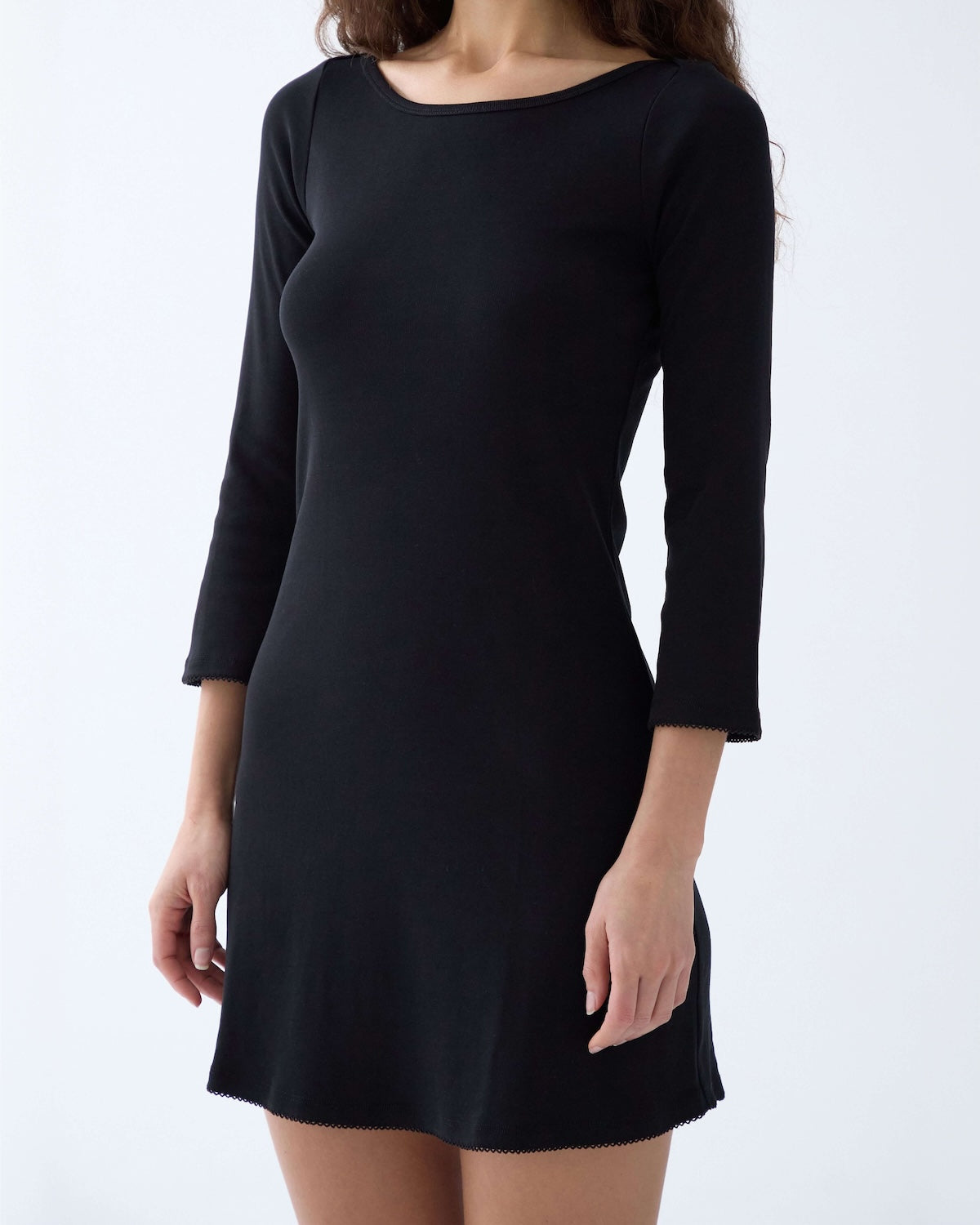 Black dress with long sleeves on a white background