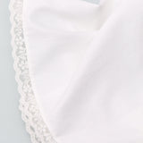White boxers with lace trim on a light gray background