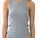 Gray tank top worn by a person on a white background