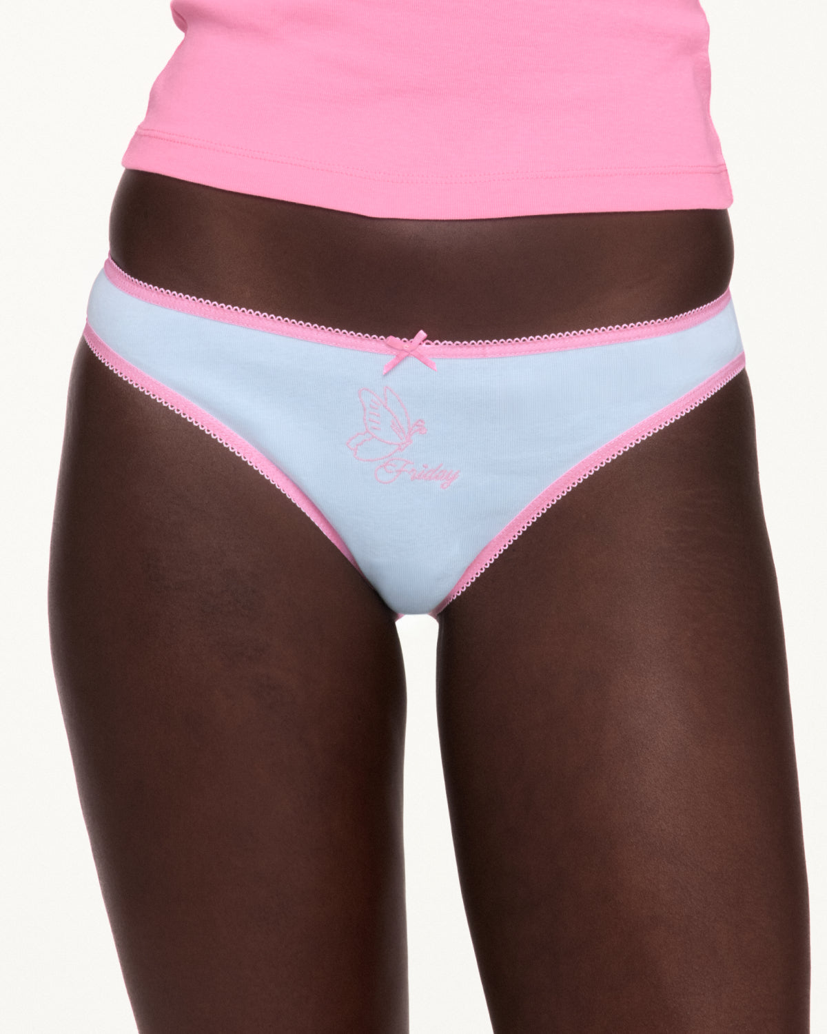 Woman wearing blue underwear with pink lace trim. 