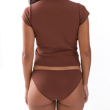 Brown t shirt and briefs worn on a plain background