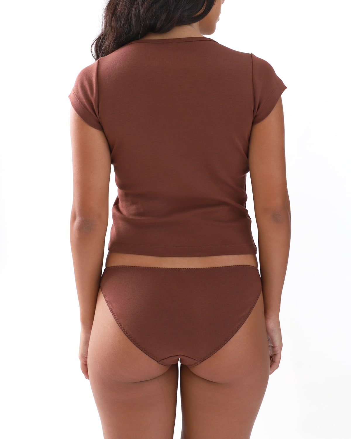 Brown t shirt and briefs worn on a plain background