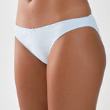 Light blue brief worn by a person on a plain background