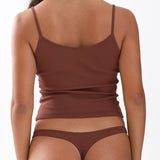 Brown tank top and underwear set on a plain background