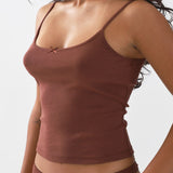 Brown tank top worn by a person on a white background