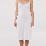 White slip dress worn by a model on a white background