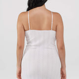 White slip dress worn by a person on a plain background