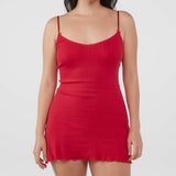 Red dress worn by a model on a white background