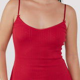Red dress with thin straps on a plain background
