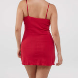 Red dress worn by a person on a white background