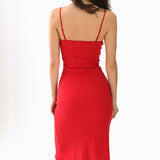 Red dress worn by a person on a white background