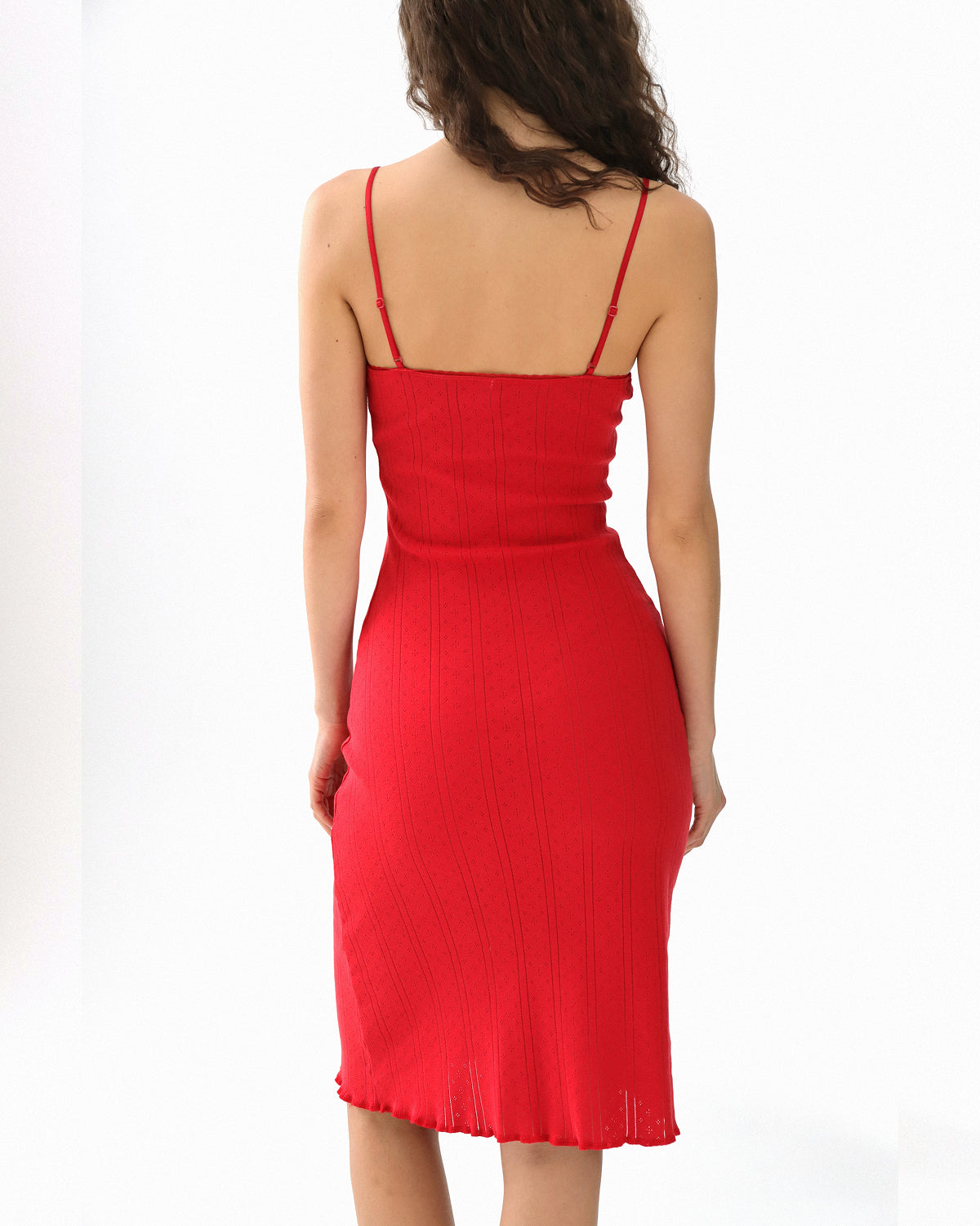 Red dress worn by a person on a white background