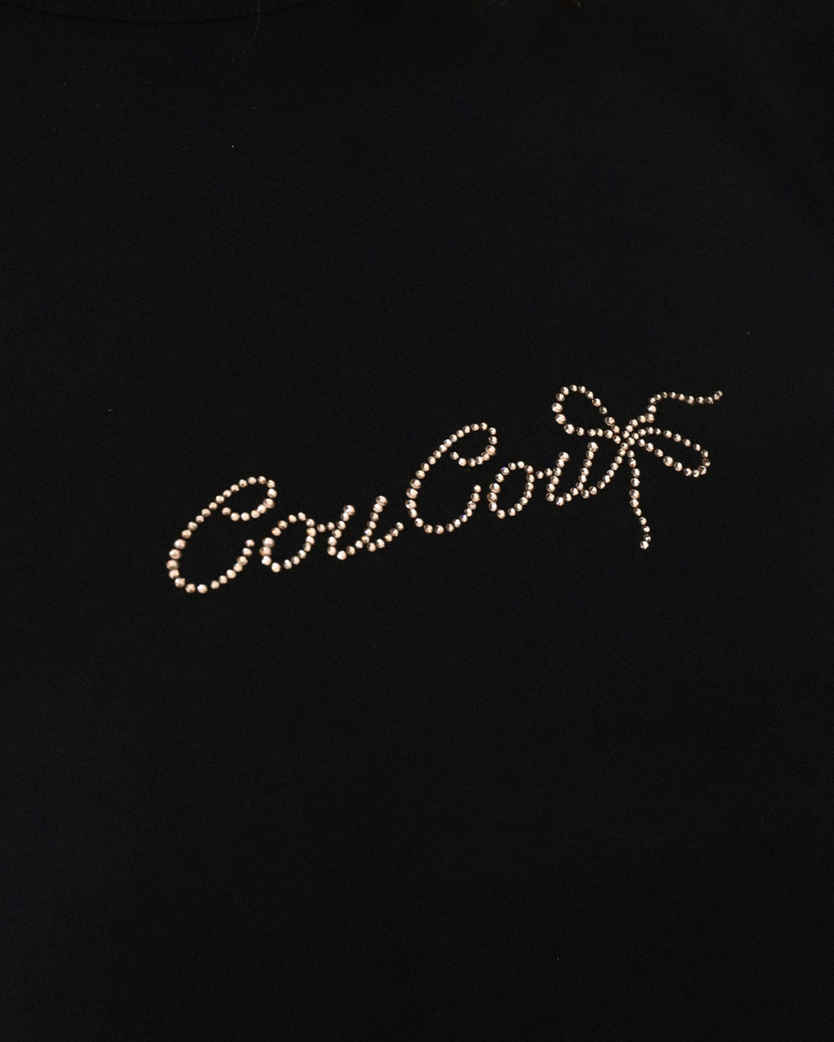 Black background with 'Cou Cou' text in rhinestones