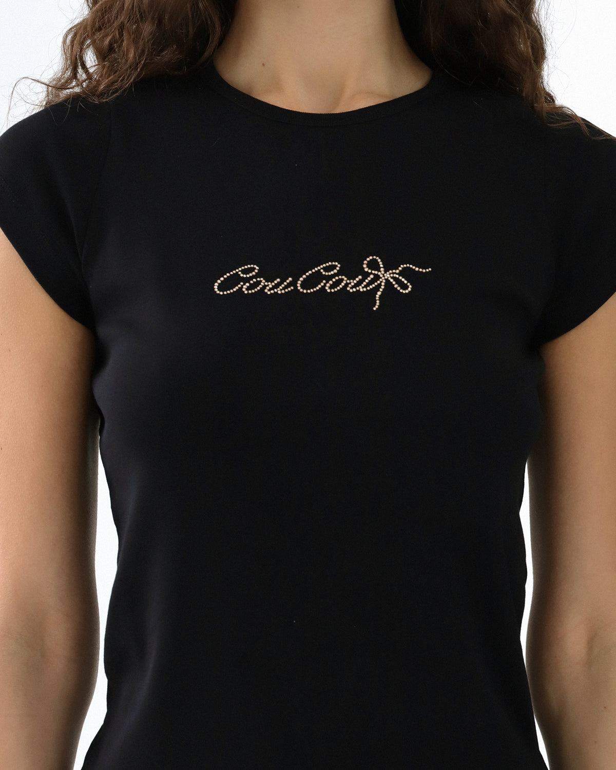 Black t-shirt with 'Coucou' text on a white background