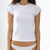 Woman wearing a white t-shirt and underwear set on a plain background