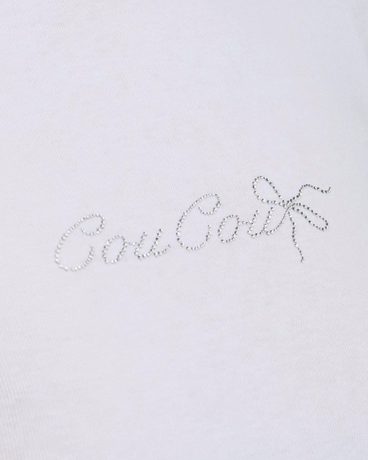 Text 'CouCou' in a decorative font on a light gray background