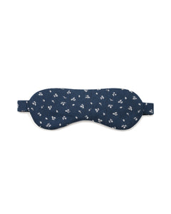 Navy sleep mask with white floral pattern on a white background