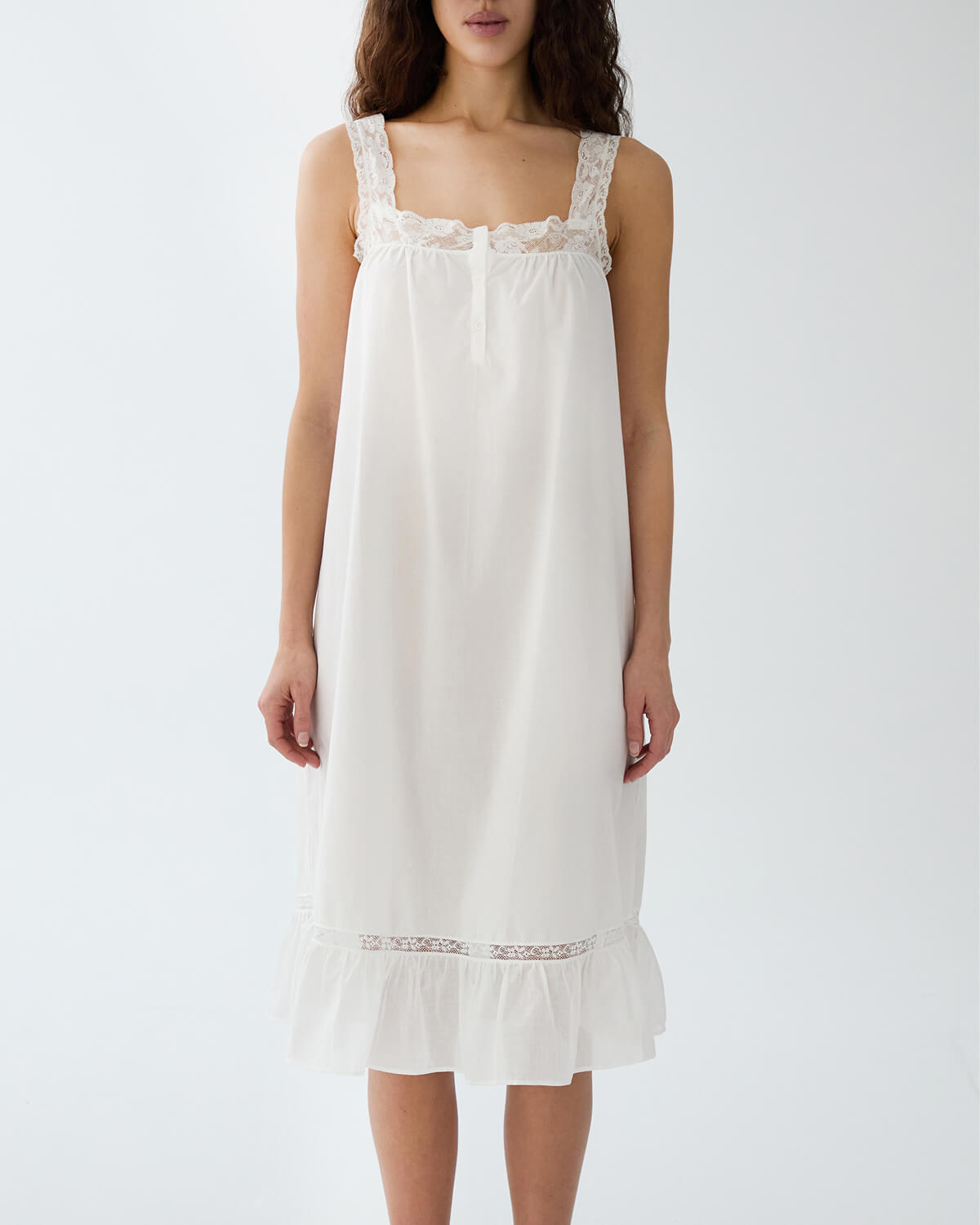 White nightgown with lace details on a white background