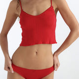 Red underwear set worn by a model on a white background
