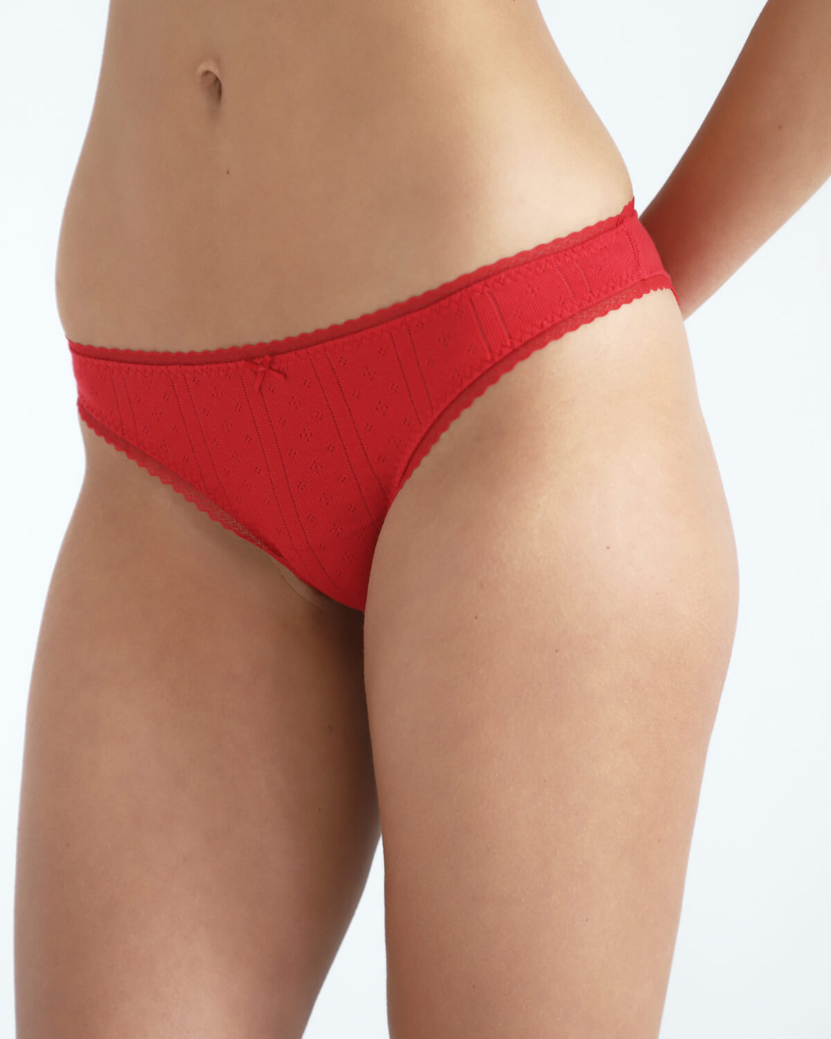 Red brief worn by a person on a white background