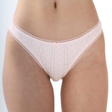White lace underwear on a plain background