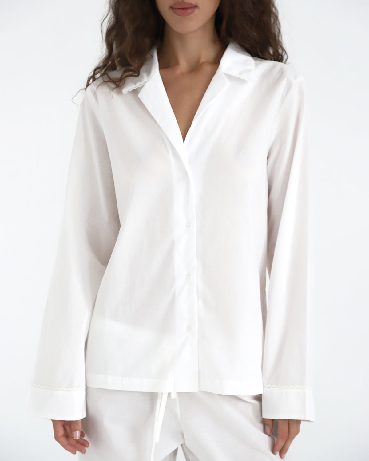 White shirt worn by a model on a white background