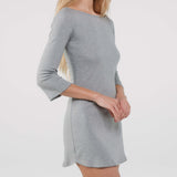 Gray dress worn by a person on a white background