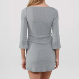 Gray dress with a three-quarter sleeve on a plain background