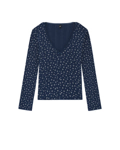 Navy blue long-sleeve top with small white pattern on a white background