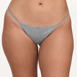 A close-up of a model wearing a light gray underwear with a small bow detail at the center front, set against a plain light background.
