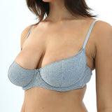 Gray bra worn by a model on a white background