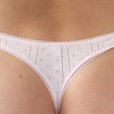 Pink lace thong on a beige background