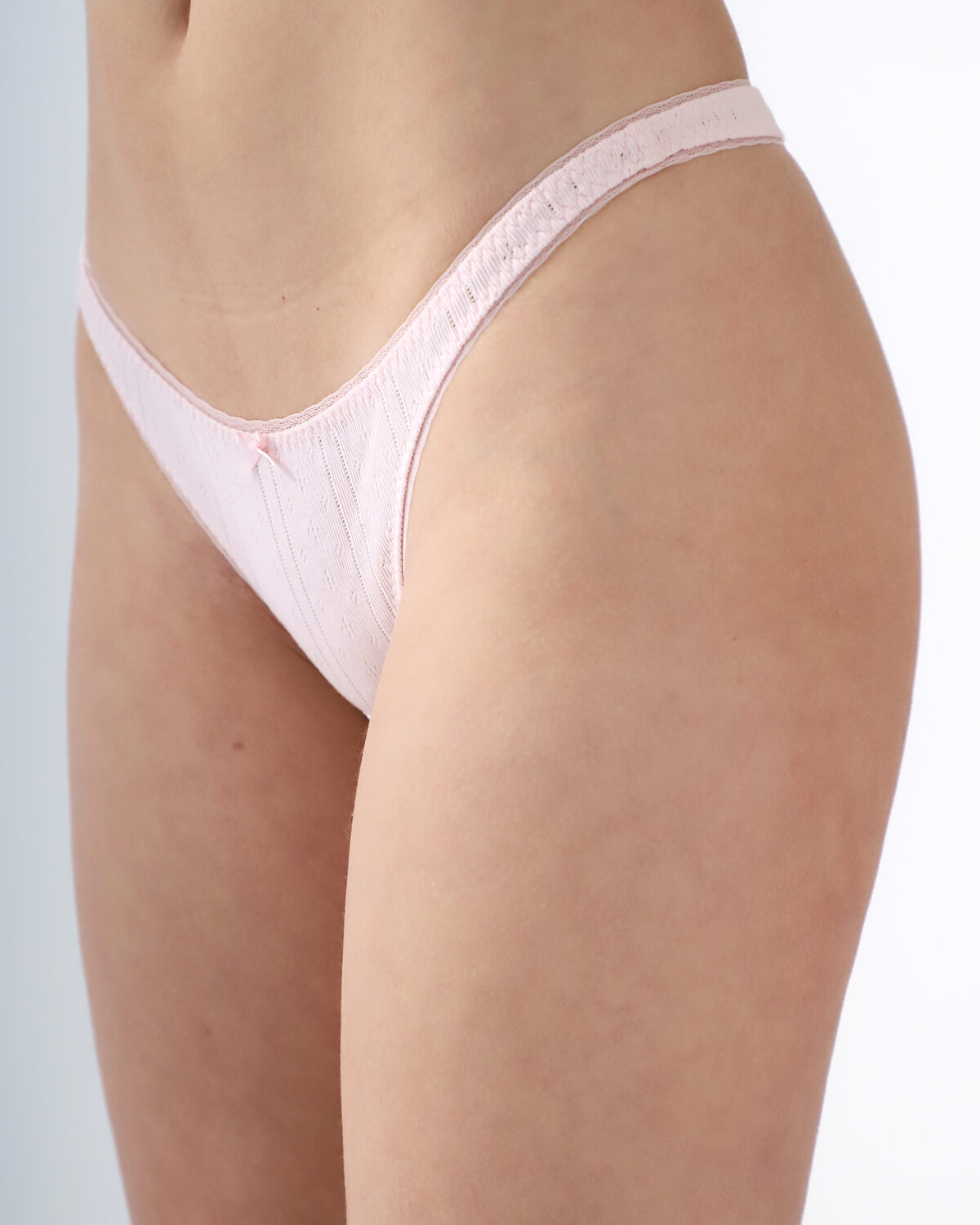 Light pink thong on a plain background