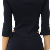 Black long-sleeve top and pants on a white background