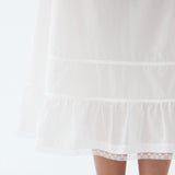 White lace-trimmed nightgown on a white background