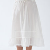 White petticoat worn by a person on a white background